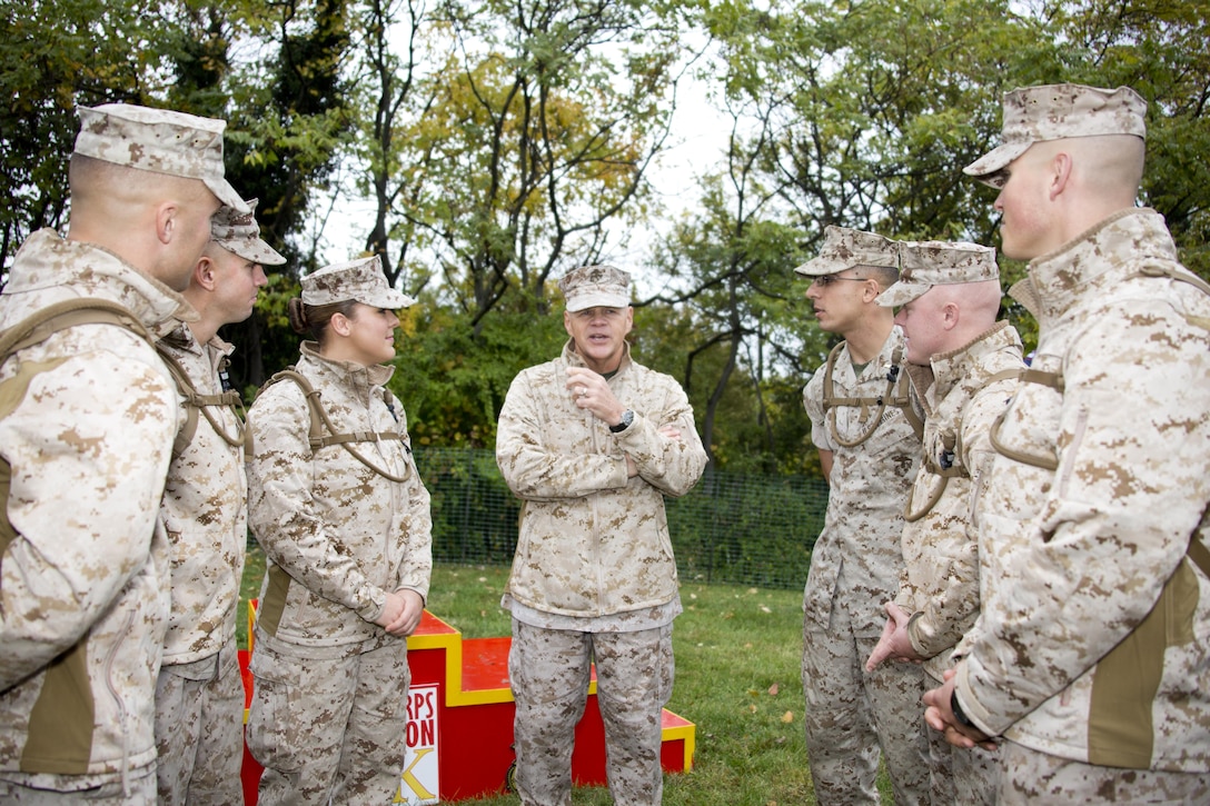Commandant of the Marine Corps, Gen. Robert B. Neller, talks to Marines during the Marine Corps Marathon at Arlington, Va., Oct. 25, 2015. Over 30,000 runners participated in the 26.2 mile, 40th annual Marine Corps Marathon. (U.S. Marine Corps photo by Sgt. Gabriela Garcia/Released)