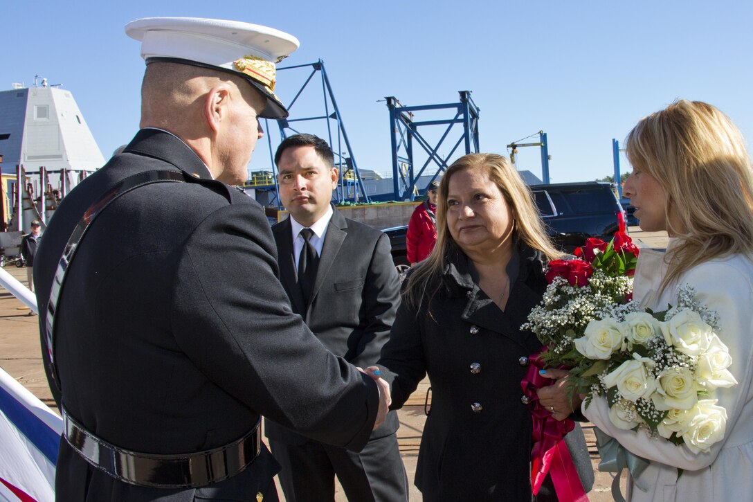 Commandant of the Marine Corps, Gen. Robert B. Neller, left, meets with Rosa Maria Peralta, center, mother of Marine Corps Sgt. Rafael Peralta, during the USS Rafael Peralta christening ceremony at General Dynamics Bath Iron Works, Bath, Maine, Oct. 31, 2015. Peralta was the sponsor and officially christened the destroyer named after her son who was killed during the second battle of Fallujah in 2004. (U.S. Marine Corps photo Sgt. Gabriela Garcia/Released)