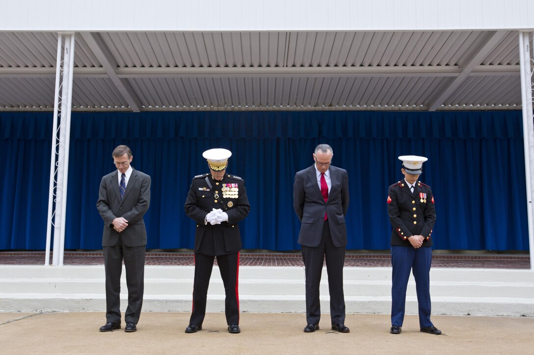 From left, Sean J. Stackley, the assistant secretary of the Navy research, development and acquisition, Commandant of the Marine Corps, Gen. Robert B. Neller, retired U.S. Marine Corps Col. Jan Durham, Lance Cpl. Michelle N. Ponce, bow during the Pentagon cake cutting ceremony invocation at Washington, D.C., Nov. 9, 2015. The ceremony celebrated the Corps' 240th birthday since it was first established on Nov. 10, 1775. (U.S. Marine Corps photo by Sgt. Gabriela Garcia/Released)