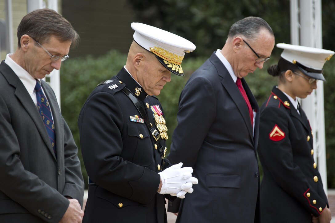 From left, Sean J. Stackley, the assistant secretary of the Navy research, development and acquisition, Commandant of the Marine Corps, Gen. Robert B. Neller, retired U.S. Marine Corps Col. Jan Durham, Lance Cpl. Michelle N. Ponce, bow during the Pentagon cake cutting ceremony invocation at Washington, D.C., Nov. 9, 2015. The ceremony celebrated the Corps' 240th birthday since it was first established on Nov. 10, 1775. (U.S. Marine Corps photo by Sgt. Gabriela Garcia/Released)