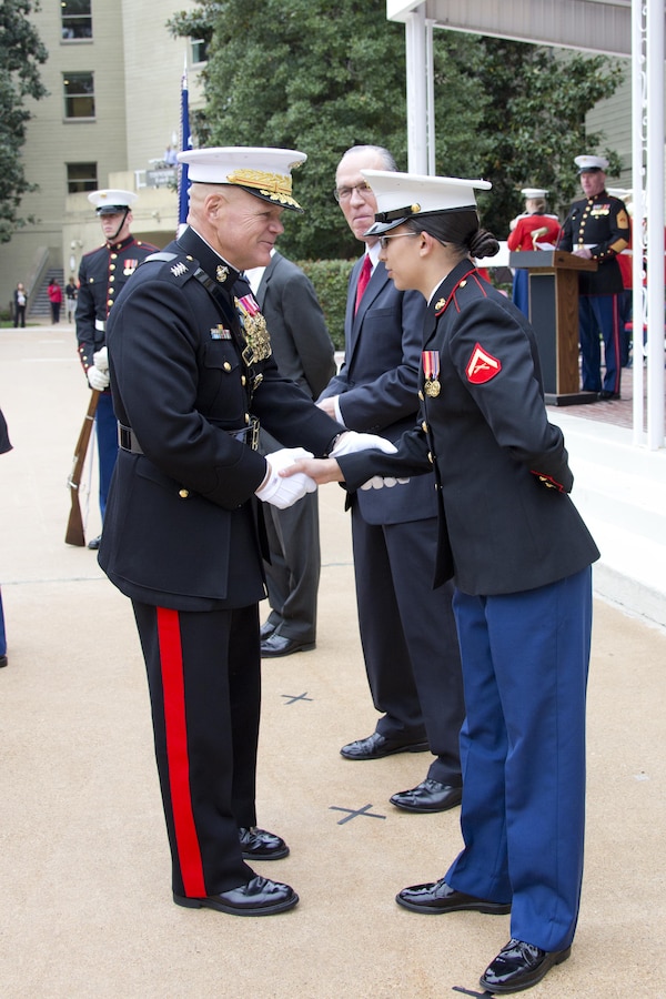 Commandant of the Marine Corps, Gen. Robert B. Neller, left, congratulates Lance Cpl. Michelle N. Ponce, the youngest Marine during the Pentagon cake cutting ceremony at Washington, D.C., Nov. 9, 2015. The ceremony celebrated the Corps' 240th birthday since it was first established on Nov. 10, 1775. (U.S. Marine Corps photo by Sgt. Gabriela Garcia/Released)
