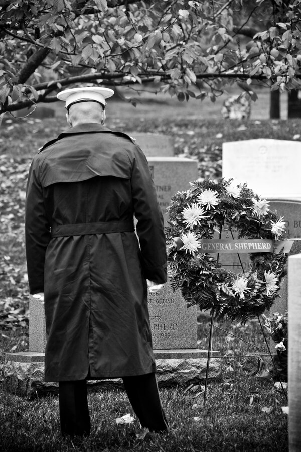 Commandant of the Marine Corps, Gen. Robert B. Neller, pays his respects in front of a wreath at Arlington, Va., Nov. 10, 2015. Neller had laid a wreath in honor of Gen. Lemuel Cornick Shepherd, Jr., the 20th Commandant of the Marine Corps. (U.S. Marine Corps photo illustration by Staff Sgt. Gabriela Garcia/Released)