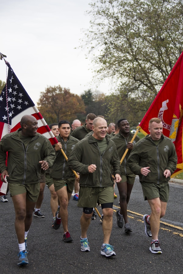 Commandant of the Marine Corps, Gen. Robert B. Neller, center, runs with Sgt. Maj. of the Marine Corps Ronald L. Green, left, Marines and Sailors at Arlington, Va., Nov. 12, 2015. Neller and Green led Marines and Sailors on a Marine Corps birthday run from the Pentagon to the Marine Corps War Memorial. (U.S. Marine Corps photo by Staff Sgt. Gabriela Garcia/Released)