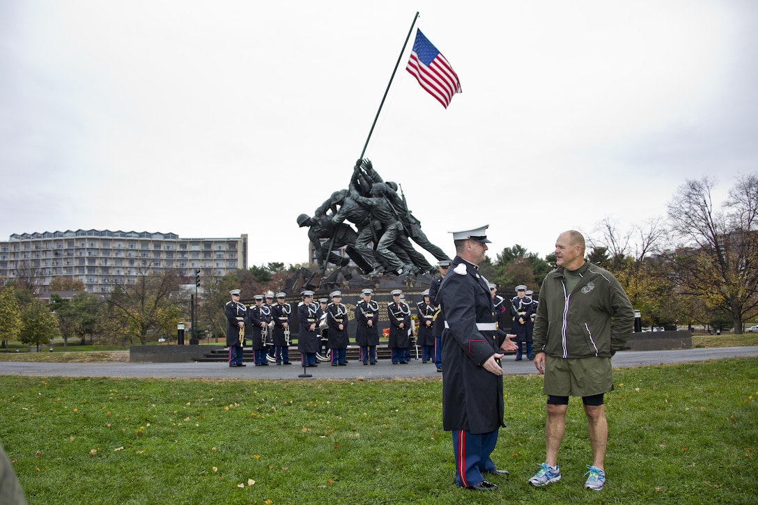 Commandant of the Marine Corps, Gen. Robert B. Neller, right, speaks with a Marine at Arlington, Va., Nov. 12, 2015. Neller led Marines and Sailors on a Marine Corps birthday run from the Pentagon to the Marine Corps War Memorial. (U.S. Marine Corps photo by Staff Sgt. Gabriela Garcia/Released)