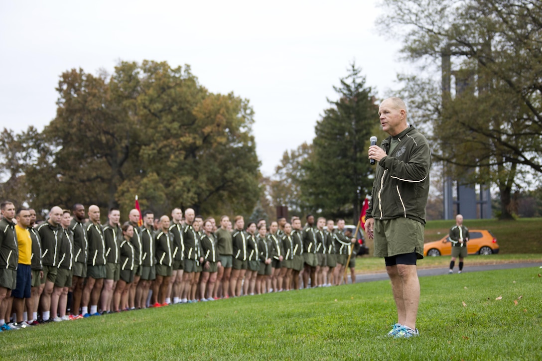 Commandant of the Marine Corps, Gen. Robert B. Neller, speaks to Marines and Sailors at Arlington, Va., Nov. 12, 2015. Neller led Marines and Sailors on a Marine Corps birthday run from the Pentagon to the Marine Corps War Memorial. (U.S. Marine Corps photo by Staff Sgt. Gabriela Garcia/Released)