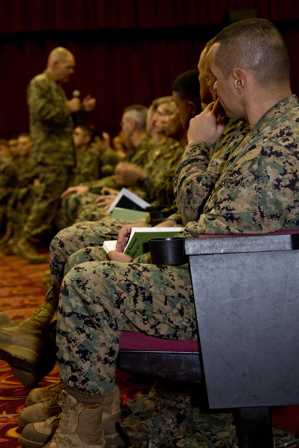 U.S. Marines listen to Commandant of the Marine Corps, Gen. Robert B. Neller, during his visit at Marine Corps Base, Hawaii, Nov. 20, 2015. Neller outlined the Corps current priorities, expectations, listened and answered Marines' questions. (U.S. Marine Corps photo by Staff Sgt. Gabriela Garcia/Released)