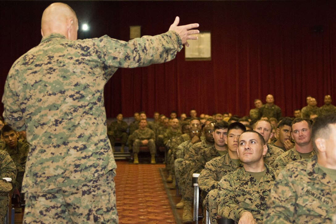 U.S. Marines listen to Commandant of the Marine Corps, Gen. Robert B. Neller, during his visit at Marine Corps Base, Hawaii, Nov. 20, 2015. Neller outlined the Corps current priorities, expectations, listened and answered Marines' questions. (U.S. Marine Corps photo by Staff Sgt. Gabriela Garcia/Released)