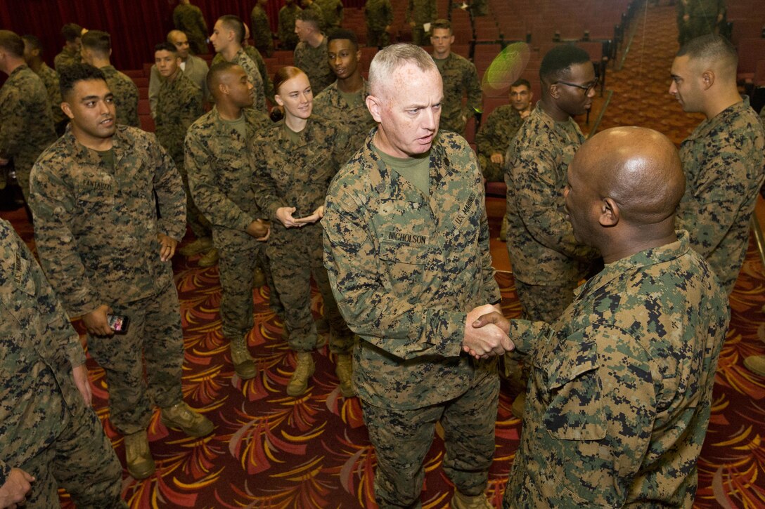 Sgt. Maj. of the Marine Corps Ronald L. Green speaks to Marines at Marine Corps Base, Hawaii, Nov. 20, 2015. Green and Commandant of the Marine Corps, Gen. Robert B. Neller outlined the Corps current priorities, expectations, listened and answered Marines' questions during their Hawaii visit. (U.S. Marine Corps photo by Staff Sgt. Gabriela Garcia/Released)