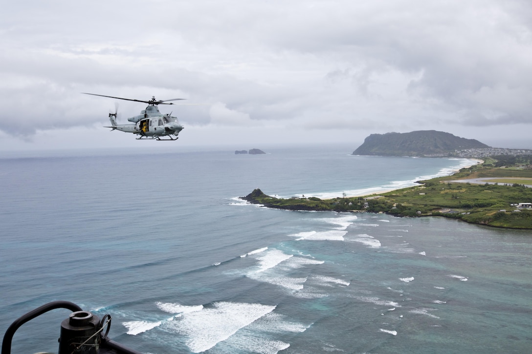 A UH-1Y huey aircraft with Marine Light Attack Helicopter Squadron 367, flies over Hawaii, Nov. 20, 2015. The unit gave Commandant of the Marine Corps, Gen. Robert B. Neller, and Sgt. Maj. of the Marine Corps Ronald L. Green, a tour of the Oahu facilities during their Hawaii visit. (U.S. Marine Corps photo by Staff Sgt. Gabriela Garcia/Released)