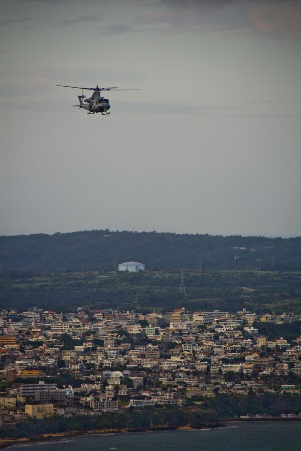 A UH-1Y Huey aircraft with Marine Light Attack Helicopter Squadron 167, flies over Okinawa, Japan, Nov. 23, 2015. The unit supported the Commandant of the Marine Corps, Gen. Robert B. Neller, and Sgt. Maj. of the Marine Corps Ronald L. Green with transportation during their Okinawa visit with Marines. (U.S. Marine Corps photo by Staff Sgt. Gabriela Garcia/Released)