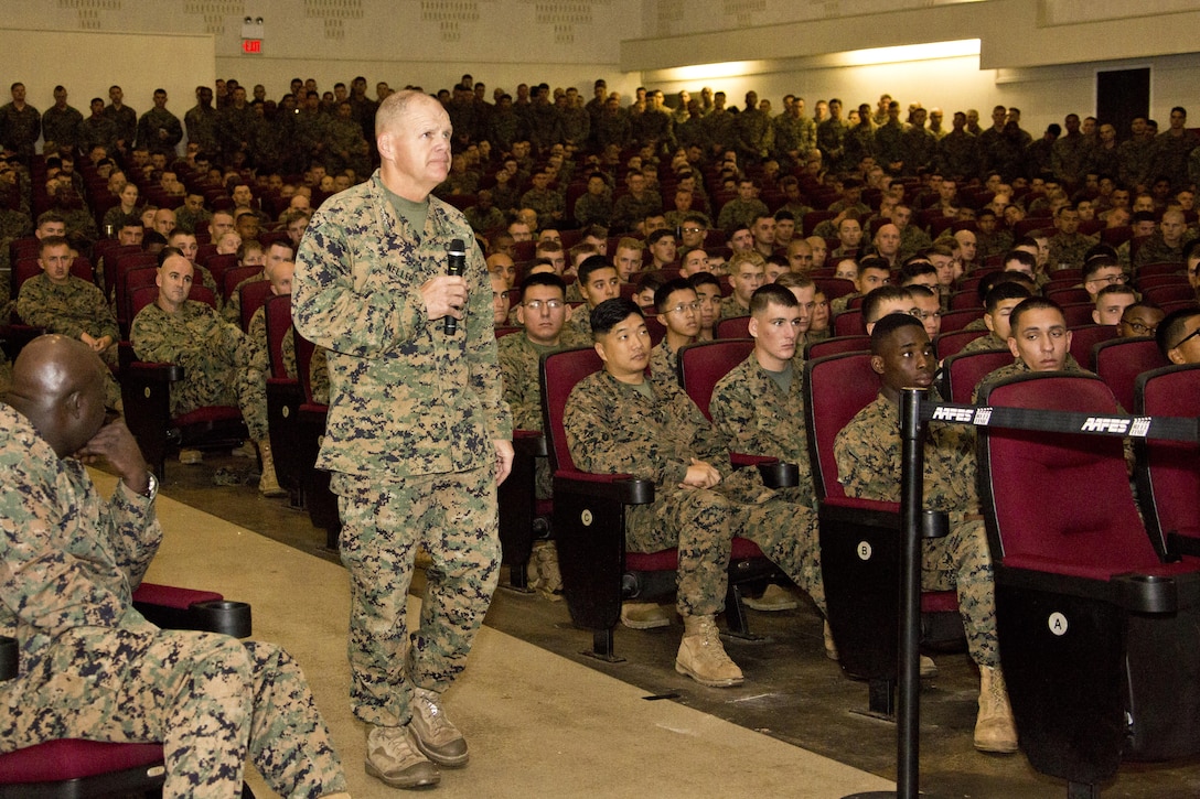 Commandant of the Marine Corps, Gen. Robert B. Neller, speaks with Marines at Okinawa, Japan, Nov. 23, 2015. Neller visited with Marines to outline the Corps' current priorities, expectations, and answer Marines' questions. (U.S. Marine Corps photo by Staff Sgt. Gabriela Garcia/Released)