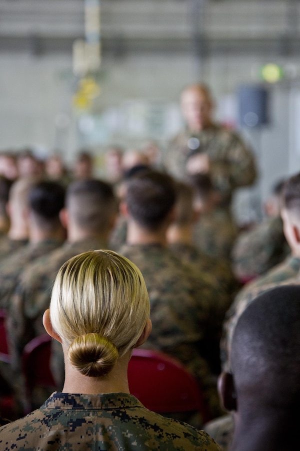 Marines listen to Commandant of the Marine Corps, Gen. Robert B. Neller, top right, at Marine Corps Air Station Futenma, Okinawa, Japan, Nov. 23, 2015. Neller visited with Marines to outline the Corps' current priorities, expectations, and answer Marines' questions. (U.S. Marine Corps photo by Staff Sgt. Gabriela Garcia/Released)