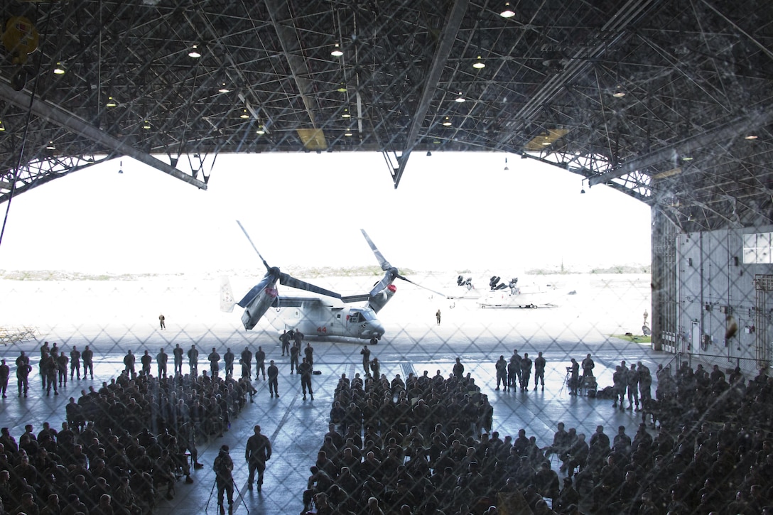 Commandant of the Marine Corps, Gen. Robert B. Neller, center left, speaks with Marines at Marine Corps Air Station Futenma, Okinawa, Japan, Nov. 23, 2015. Neller visited with Marines to outline the Corps' current priorities, expectations, and answer Marines' questions. (U.S. Marine Corps photo by Staff Sgt. Gabriela Garcia/Released)