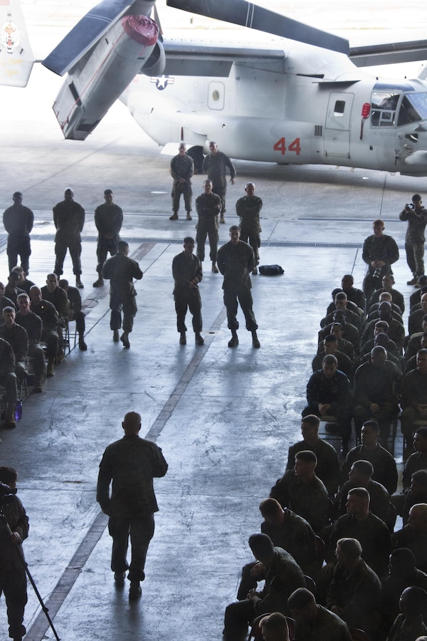 Commandant of the Marine Corps, Gen. Robert B. Neller, bottom, speaks with Marines at Marine Corps Air Station Futenma, Okinawa, Japan, Nov. 23, 2015. Neller visited with Marines to outline the Corps' current priorities, expectations, and answer Marines' questions. (U.S. Marine Corps photo by Staff Sgt. Gabriela Garcia/Released)