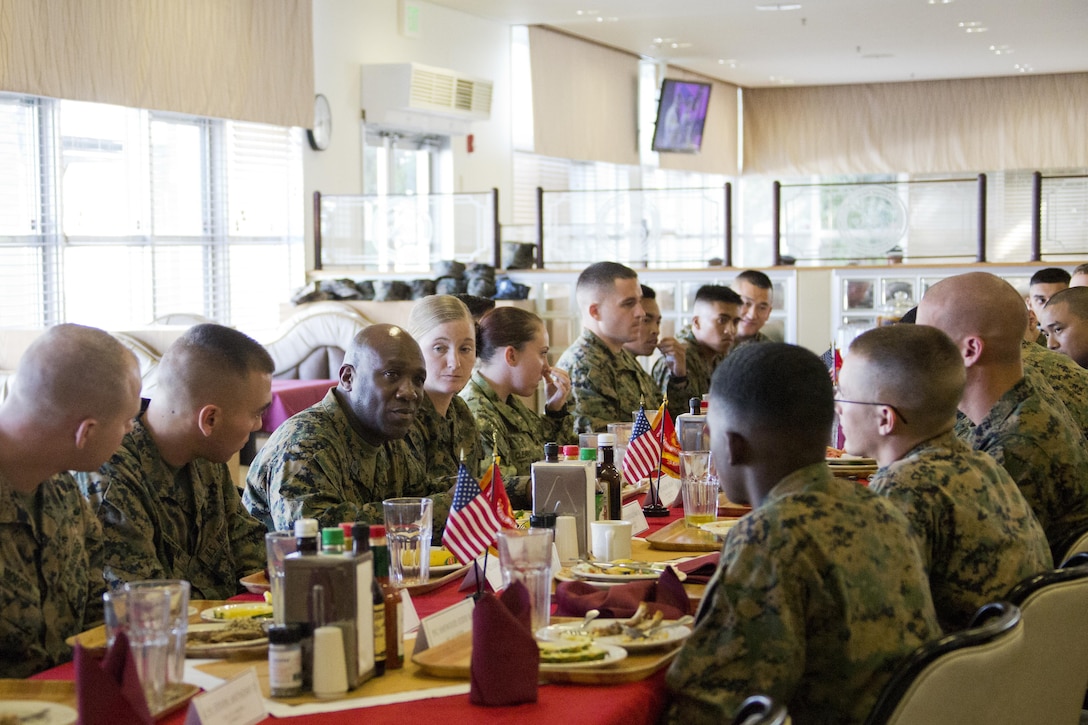 Sgt. Maj. of the Marine Corps Ronald L. Green, third left, listens to Marines at Camp Foster, Okinawa, Japan, Nov. 23, 2015. Commandant of the Marine Corps, Gen. Robert B. Neller and Green had lunch with Marines during their Okinawa visit. (U.S. Marine Corps photo by Staff Sgt. Gabriela Garcia/Released)