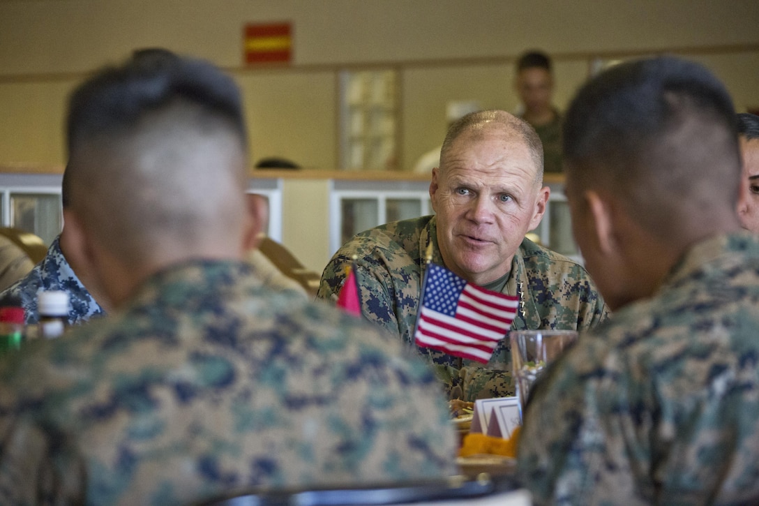 Commandant of the Marine Corps, Gen. Robert B. Neller, talks to Marines at Camp Foster, Okinawa, Japan, Nov. 23, 2015. Neller and Sgt. Maj. of the Marine Corps Ronald L. Green had lunch with Marines during their Okinawa visit. (U.S. Marine Corps photo by Staff Sgt. Gabriela Garcia/Released)