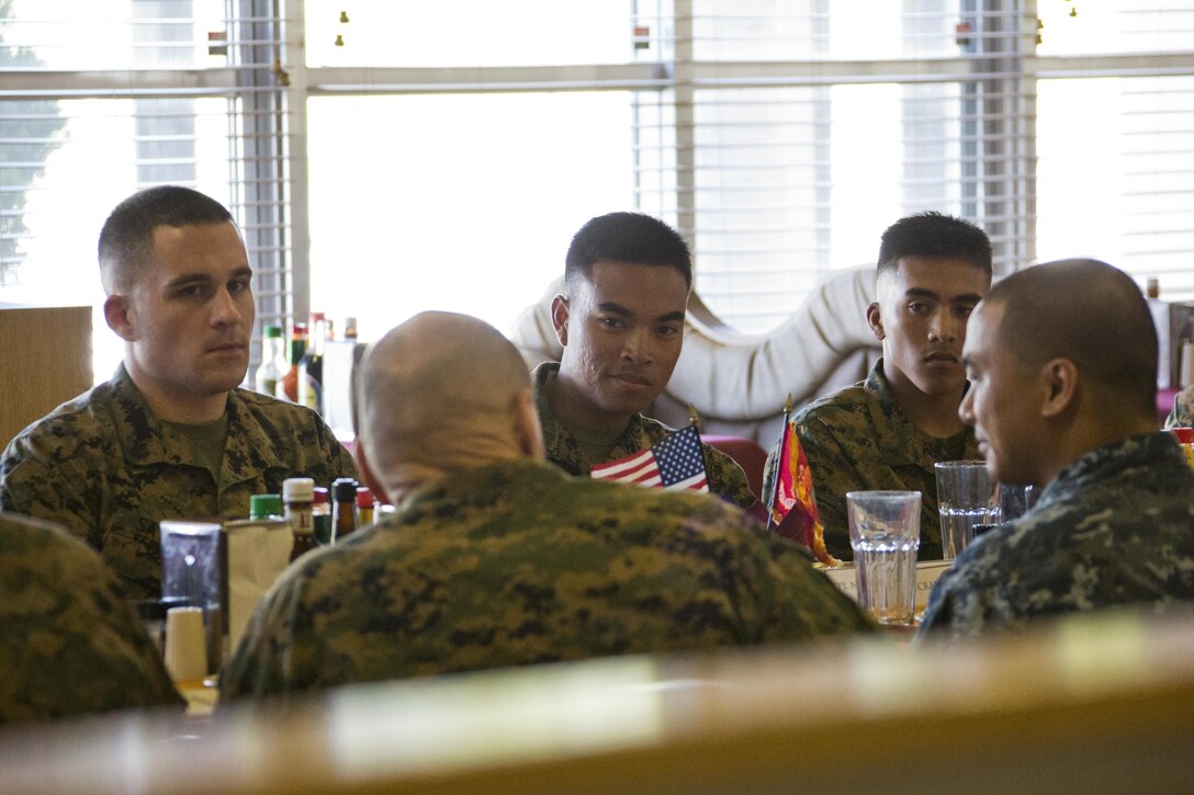Marines listen to Commandant of the Marine Corps, Gen. Robert B. Neller, center, at Camp Foster, Okinawa, Japan, Nov. 23, 2015. Neller and Sgt. Maj. of the Marine Corps Ronald L. Green had lunch with Marines during their Okinawa visit. (U.S. Marine Corps photo by Staff Sgt. Gabriela Garcia/Released)