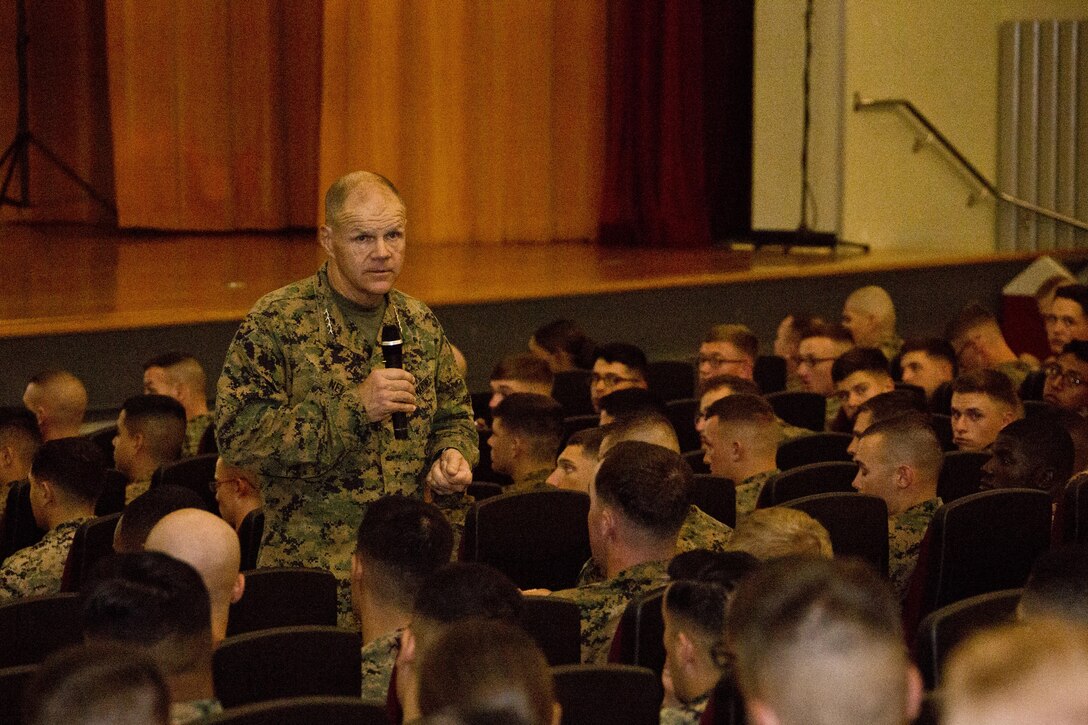 Commandant of the Marine Corps, Gen. Robert B. Neller, speaks with Marines at Camp Foster, Okinawa, Japan, Nov. 23, 2015. Neller visited with Marines to outline the Corps' current priorities, expectations, and answer Marines' questions. (U.S. Marine Corps photo by Staff Sgt. Gabriela Garcia/Released)