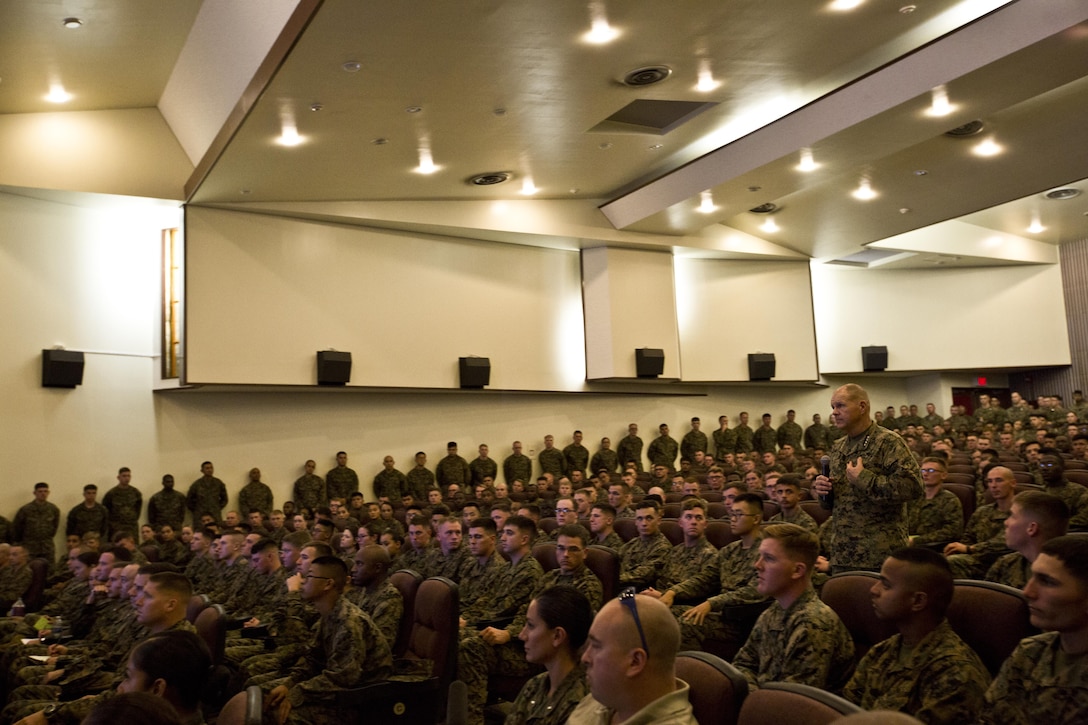 Commandant of the Marine Corps, Gen. Robert B. Neller, speaks with Marines at Camp Foster, Okinawa, Japan, Nov. 23, 2015. Neller visited with Marines to outline the Corps' current priorities, expectations, and answer Marines' questions. (U.S. Marine Corps photo by Staff Sgt. Gabriela Garcia/Released)