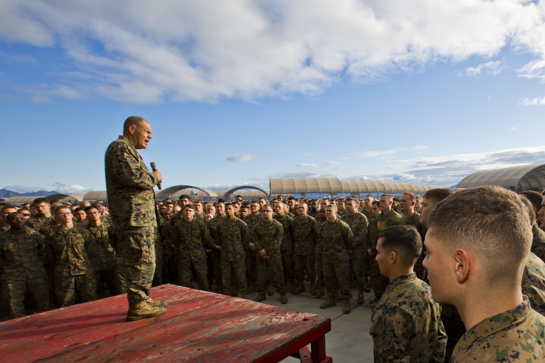 Commandant of the Marine Corps, Gen. Robert B. Neller speaks with Marines at Marine Corps Air Station Iwakuni, Okinawa, Japan, Nov. 24, 2015. Neller and Sgt. Maj. of the Marine Corps Ronald L. Green visited Marines to outline the Corps' current priorities, expectations, and answer questions. (U.S. Marine Corps photo by Staff Sgt. Gabriela Garcia/Released)
