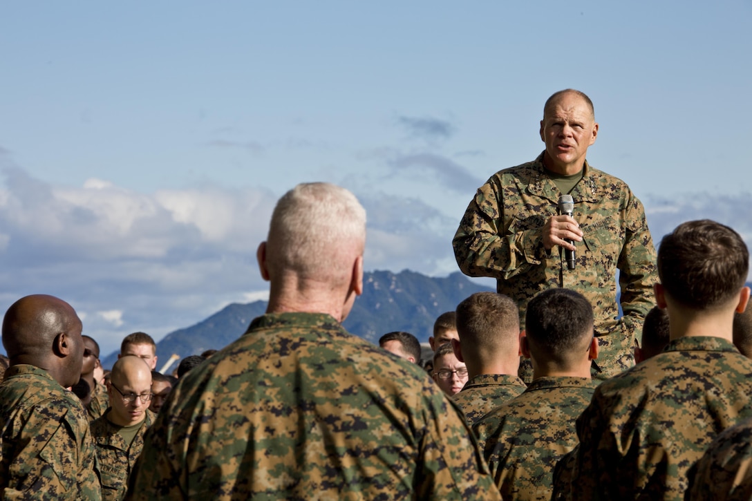 Commandant of the Marine Corps, Gen. Robert B. Neller speaks with Marines at Marine Corps Air Station Iwakuni, Okinawa, Japan, Nov. 24, 2015. Neller and Sgt. Maj. of the Marine Corps Ronald L. Green visited Marines to outline the Corps' current priorities, expectations, and answer questions. (U.S. Marine Corps photo by Staff Sgt. Gabriela Garcia/Released)