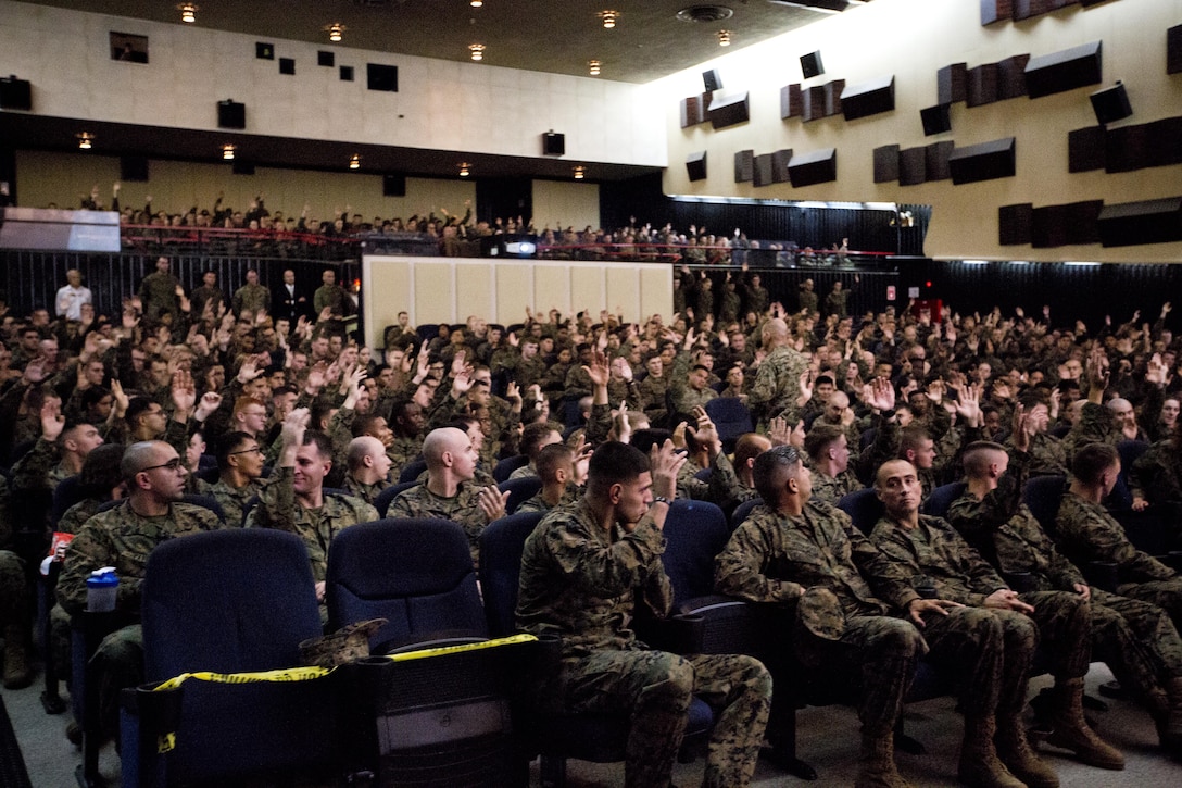 Commandant of the Marine Corps, Gen. Robert B. Neller speaks with Marines at Marine Corps Air Station Iwakuni, Okinawa, Japan, Nov. 24, 2015. Neller and Sgt. Maj. of the Marine Corps Ronald L. Green visited Marines to outline the Corps' current priorities, expectations, and answer questions. (U.S. Marine Corps photo by Staff Sgt. Gabriela Garcia/Released)