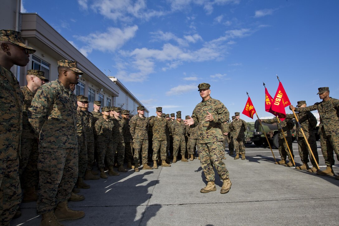 Commandant of the Marine Corps, Gen. Robert B. Neller speaks with Marines at Marine Corps Air Station Iwakuni, Okinawa, Japan, Nov. 24, 2015. Neller and Sgt. Maj. of the Marine Corps Ronald L. Green visited Marines to outline the Corps' current priorities, expectations, and answer questions. (U.S. Marine Corps photo by Staff Sgt. Gabriela Garcia/Released)