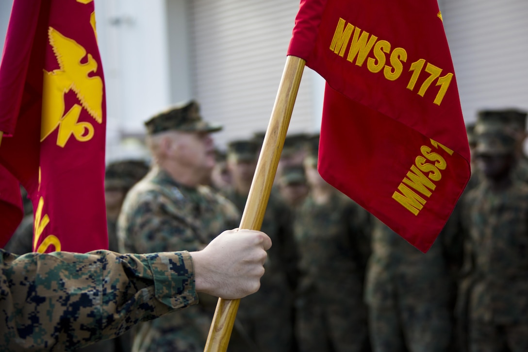 U.S. Marines listen to Commandant of the Marine Corps, Gen. Robert B. Neller speak at Marine Corps Air Station Iwakuni, Okinawa, Japan, Nov. 24, 2015. Neller and Sgt. Maj. of the Marine Corps Ronald L. Green visited Marines to outline the Corps' current priorities, expectations, and answer questions. (U.S. Marine Corps photo by Staff Sgt. Gabriela Garcia/Released)