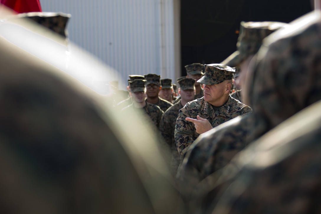 Commandant of the Marine Corps, Gen. Robert B. Neller speaks with Marines at Marine Corps Air Station Iwakuni, Okinawa, Japan, Nov. 24, 2015. Neller and Sgt. Maj. of the Marine Corps Ronald L. Green visited Marines to outline the Corps' current priorities, expectations, and answer questions. (U.S. Marine Corps photo by Staff Sgt. Gabriela Garcia/Released)