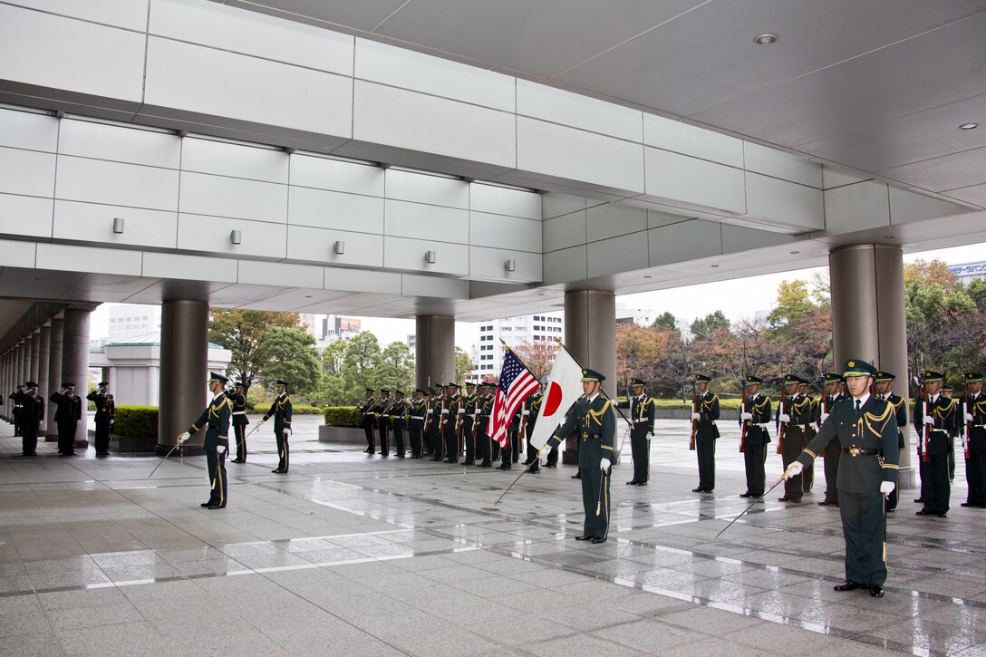 Japanese service members perform a Guard of Honor ceremony at Tokyo, Japan, Nov. 25, 2015. The ceremony was held in honor of Commandant of the Marine Corps, Gen. Robert B. Neller during his Japan visit. (U.S. Marine Corps photo by Staff Sgt. Gabriela Garcia/Released)