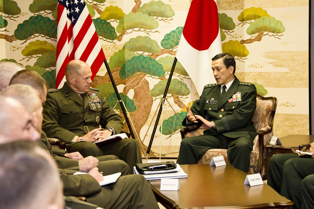Commandant of the Marine Corps, Gen. Robert B. Neller, center, meets with Japan General Kiyohumi Iwata, right, the Japan Ground Self-Defense Force chief of staff, at Tokyo, Japan, Nov. 25, 2015. Neller met with Iwata and other Japanese defense officials during his Japan visit. (U.S. Marine Corps photo by Staff Sgt. Gabriela Garcia/Released)