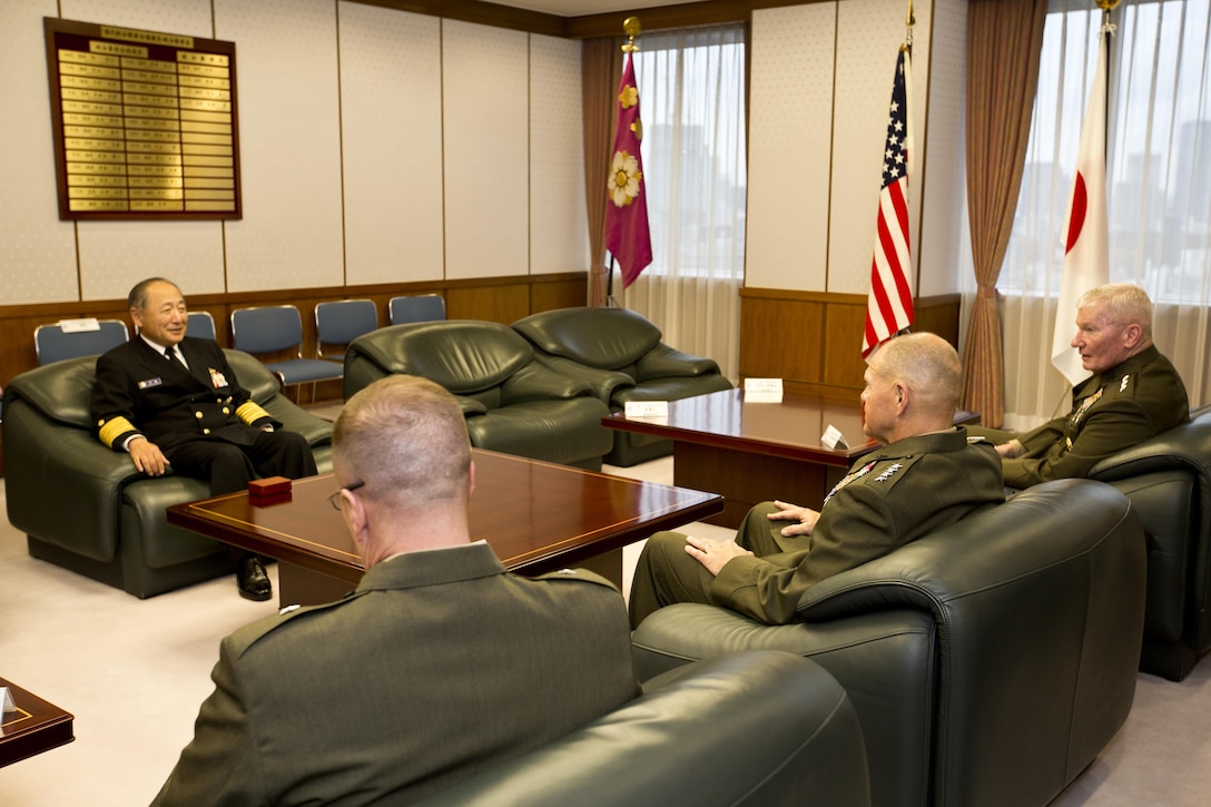 Commandant of the Marine Corps, Gen. Robert B. Neller, center right, meets with Japan Admiral Katsutoshi Kawano, left, the chief of joint staff, at Tokyo, Japan, Nov. 25, 2015. Neller met with Kawano and other Japanese defense officials during his Japan visit. (U.S. Marine Corps photo by Staff Sgt. Gabriela Garcia/Released)