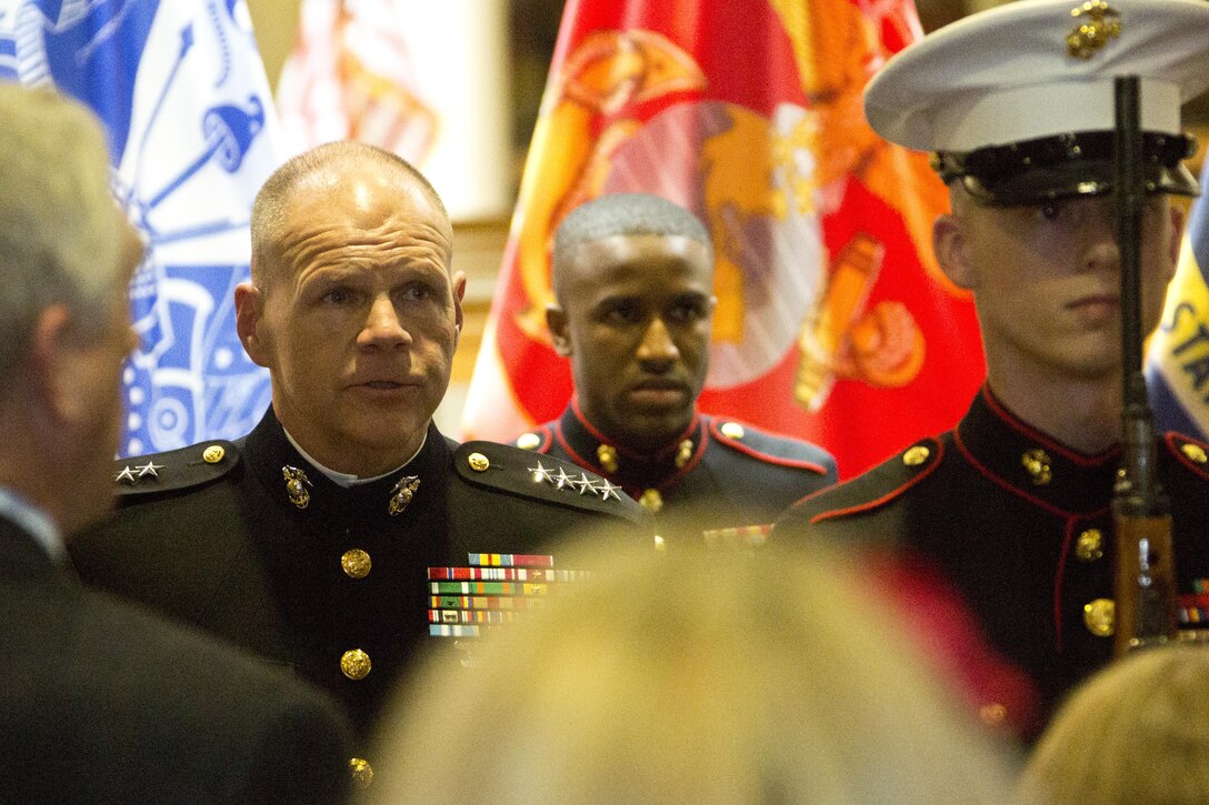 Commandant of the Marine Corps, Gen. Robert B. Neller sings the national anthem during a portrait unveiling ceremony at Atlanta, Ga., Dec. 2, 2015. Neller was the guest of honor speaker at retired Gen. Raymond G. Davis's portrait unveiling ceremony inside the Floyd Veterans Memorial Building. (U.S. Marine Corps photo by Staff Sgt. Gabriela Garcia/Released)