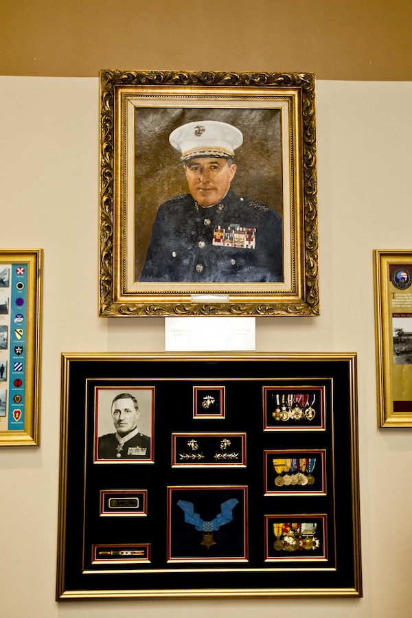 Commandant of the Marine Corps, Gen. Robert B. Neller attends a portrait unveiling ceremony at Atlanta, Ga., Dec. 2, 2015. Neller was the guest of honor speaker at retired Gen. Raymond G. Davis's portrait unveiling ceremony inside the Floyd Veterans Memorial Building. (U.S. Marine Corps photo by Staff Sgt. Gabriela Garcia/Released)