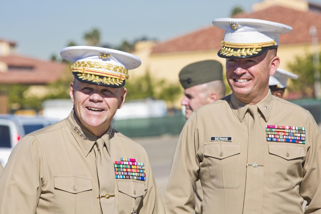 Commandant of the Marine Corps, Gen. Robert B. Neller, left, laughs alongside Brig. Gen. James W. Bierman, Jr., at Marine Corps Recruit Depot San Diego, Calif., Dec. 3, 2015. Neller visited Marines to speak about the Corps' priorities, expectations, and answered questions. (U.S. Marine Corps photo by Staff Sgt. Gabriela Garcia/Released)