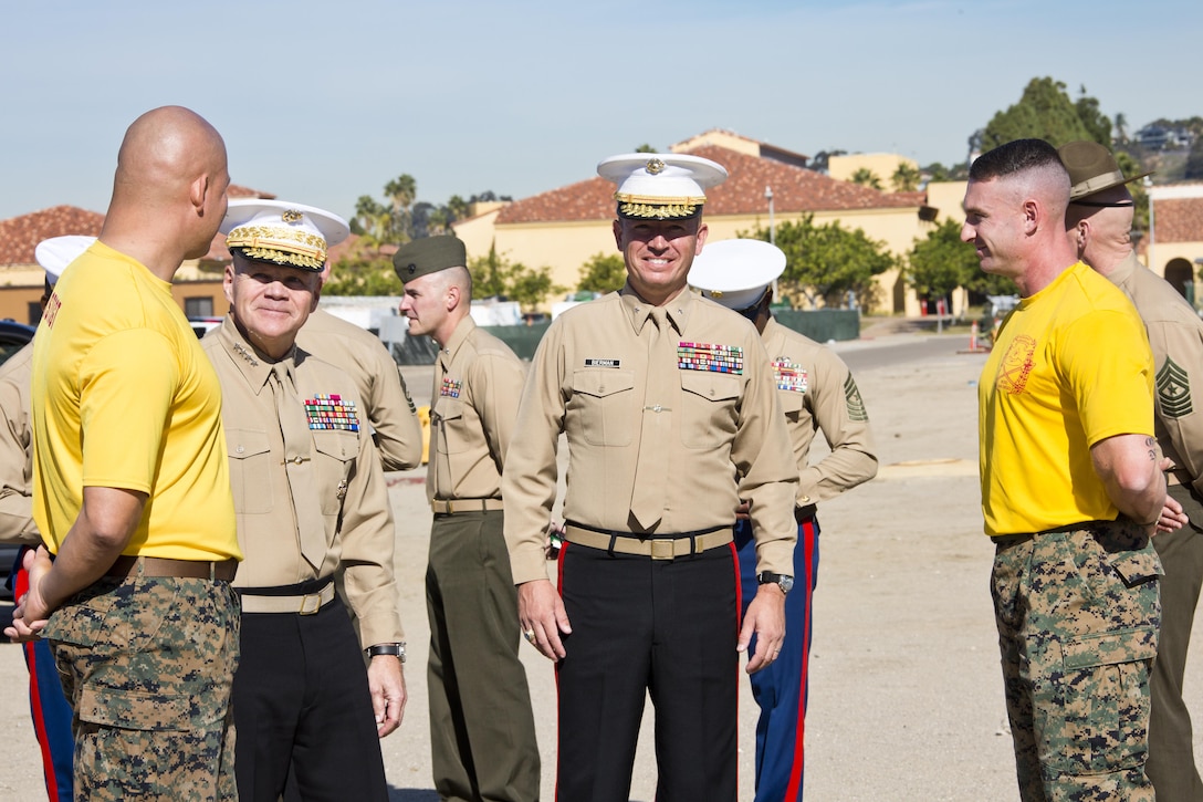 Commandant of the Marine Corps, Gen. Robert B. Neller, second left, and Brig. Gen. James W. Bierman, Jr., center, talk with Marines at Marine Corps Recruit Depot San Diego, Calif., Dec. 3, 2015. Neller spoke to Marines about the Corps' priorities, expectations, and answered their questions during his visit. (U.S. Marine Corps photo by Staff Sgt. Gabriela Garcia/Released)