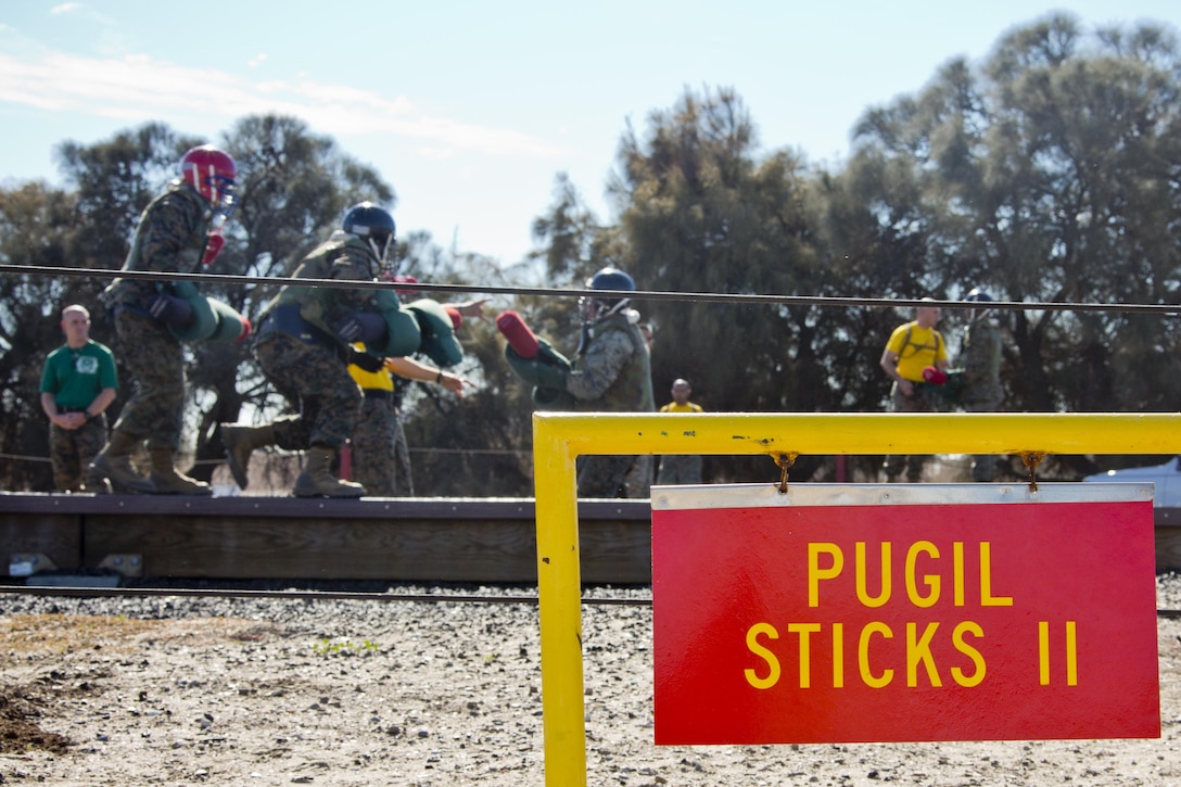 Recruits execute pugil sticks at Marine Corps Recruit Depot San Diego, Calif., Dec. 3, 2015. Pugil Sticks is part of the 12 week training every recruit must undergo before earning the title of a U.S. Marine. (U.S. Marine Corps photo by Staff Sgt. Gabriela Garcia/Released)
