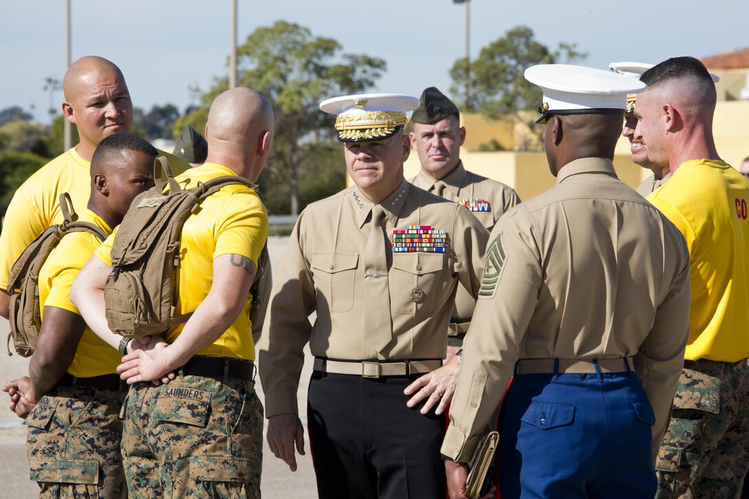 Commandant of the Marine Corps, Gen. Robert B. Neller, center, listens to Marines at Marine Corps Recruit Depot San Diego, Calif., Dec. 3, 2015. Neller spoke to Marines about the Corps' priorities, expectations, and answered questions during his visit. (U.S. Marine Corps photo by Staff Sgt. Gabriela Garcia/Released)