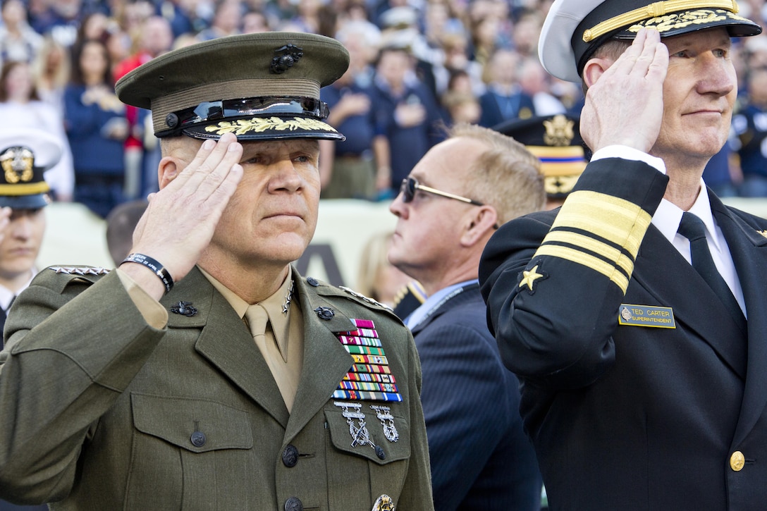 Commandant of the Marine Corps, Gen. Robert B. Neller salutes during the Army-Navy game at Lincoln Financial Field in Philadelphia, Pa., Dec. 12, 2015. Neller participated in the game's coin toss done by Secretary of Defense, Ashton B. Carter. (U.S. Marine Corps photo by Staff Sgt. Gabriela Garcia/Released)