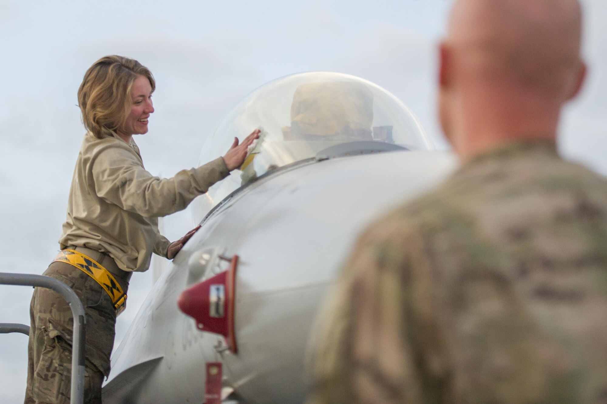 Staff Sgt. Eve Dorshorst, 455th Expeditionary Aircraft Maintenance Squadron crew chief, deployed from Hill Air Force Base, Utah, cleans the canopy of an F-16 Fighting Falcon at Bagram Airfield, Afghanistan, Jan. 06, 2016. The 455th EAMXS provides combat-ready aircraft to the air component commander in support of coalition forces throughout Afghanistan. (U.S. Air Force photo/Tech. Sgt. Robert Cloys)