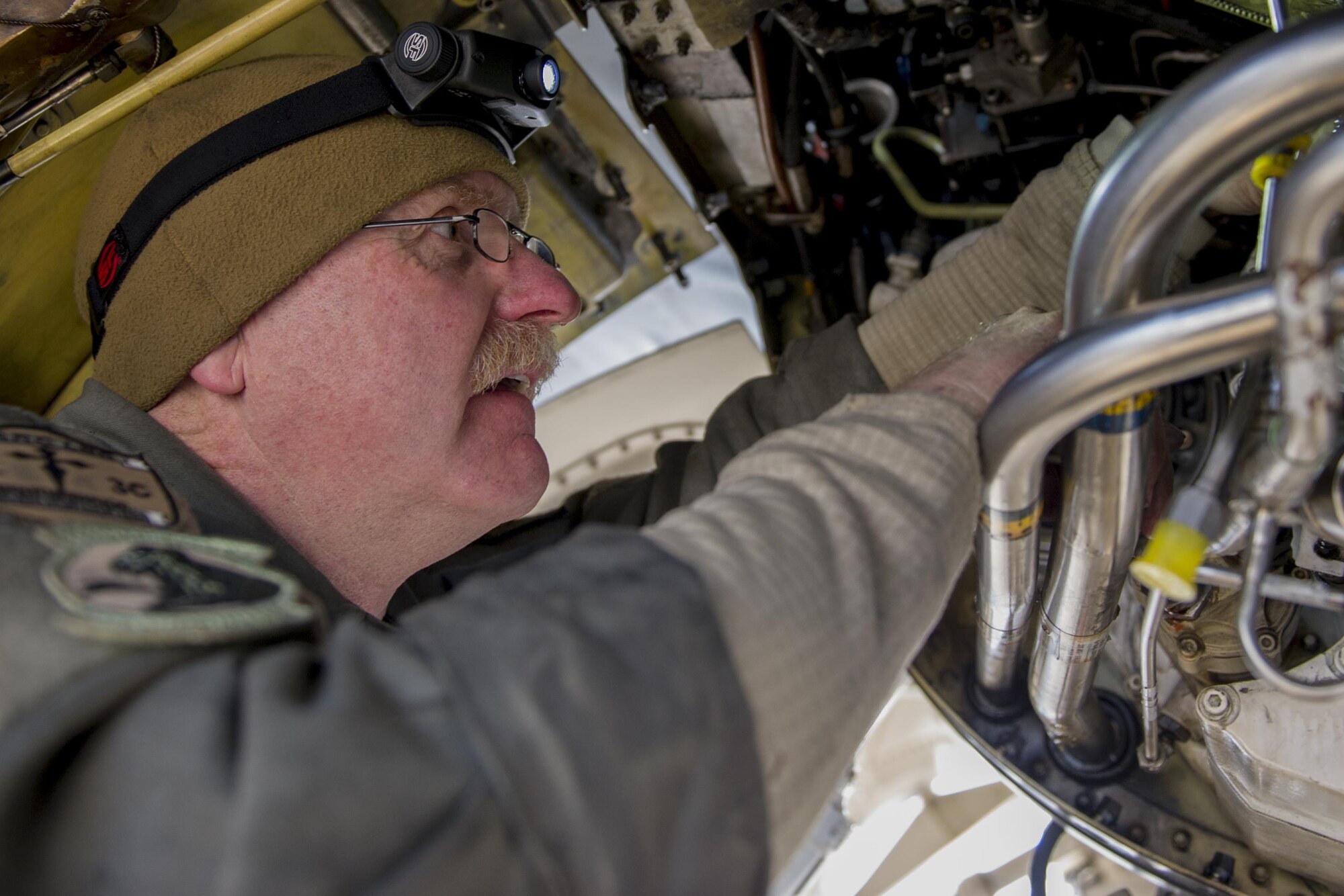 Master Sgt. Jim Anderson, 455th Expeditionary Aircraft Maintenance Squadron, deployed from Hill Air Force Base, Utah, removes and replaces a jet fuel starter on an F-16 Fighting Falcon at Bagram Airfield, Afghanistan, Jan. 8, 2016. The 455th EAMXS provides combat-ready aircraft to the air component commander in support of coalition forces throughout Afghanistan. (U.S. Air Force photo/Tech. Sgt. Robert Cloys)