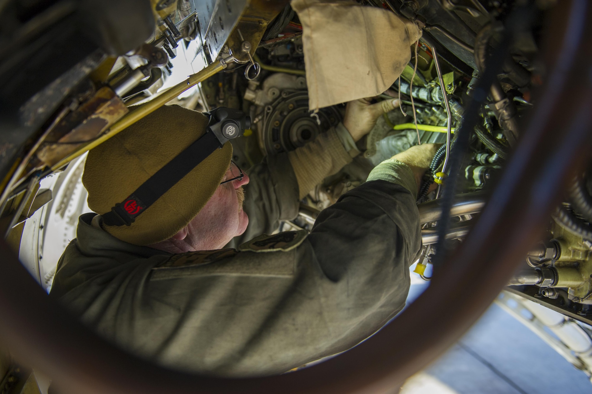 Master Sgt. Jim Anderson, 455th Expeditionary Aircraft Maintenance Squadron, deployed from Hill Air Force Base, Utah, removes and replaces a jet fuel starter on an F-16 Fighting Falcon at Bagram Airfield, Afghanistan, Jan. 8, 2016. The 455th EAMXS provides combat-ready aircraft to the air component commander in support of coalition forces throughout Afghanistan.  (U.S. Air Force photo/Tech. Sgt. Robert Cloys)