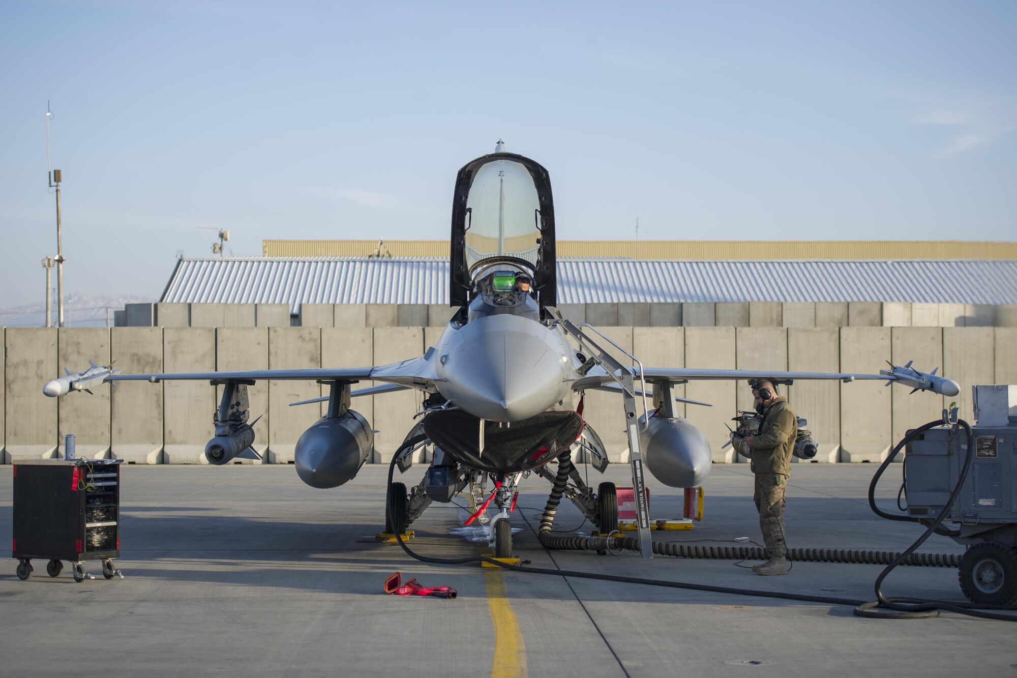 Tech. Sgt. Ritchie Videna (cockpit) and Staff Sgt. Matthew Crabtree (right), 455th Expeditionary Aircraft Maintenance Squadron avionics systems technicians, perform a chaff and flare operations check on an F-16 Fighting Falcon at Bagram Airfield, Afghanistan, Jan. 8, 2016. The 455th EAMXS provides combat-ready aircraft to the air component commander in support of coalition forces throughout Afghanistan. (U.S. Air Force photo/Tech. Sgt. Robert Cloys)