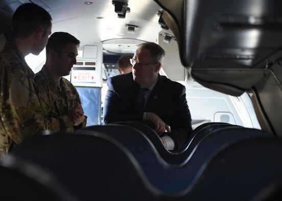 Deputy Secretary of Defense Bob Work speaks with Capt. Joseph Daniele, center, and Airman 1st Class Nicholas Harris, Airmen with the 524th Special Operations Squadron, at Hurlburt Field, Fla., Jan. 6, 2016. The deputy secretary of defense visited Hurlburt to talk with troops and speak to the leadership of Air Force Special Operations Command. (U.S. Air Force photo by Airman 1st Class Kai White)
