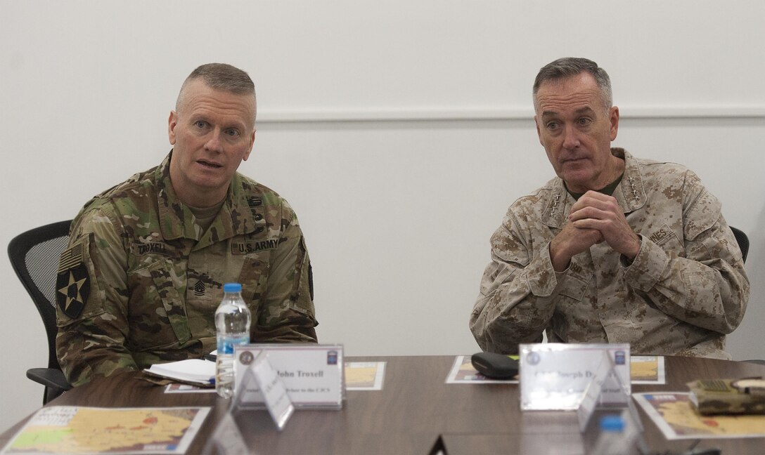 U.S. Marine Corps Gen. Joseph F. Dunford Jr., right, chairman of the Joint Chiefs of Staff,  and U.S. Army Command Sgt. Maj. John W. Troxell, Senior Enlisted Advisor to the chairman of the Joint Chiefs of Staff, listen to a brief about the security situation in the Kurdish region at a facility near Erbil, Iraq Jan. 8th, 2016. Dunford met with U.S. and coalition leaders in Germany, Iraq and Turkey to assess the progress of counter-ISIL efforts. DoD photo by Navy Petty Officer 2nd Class Dominique A. Pineiro