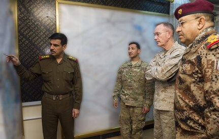 U.S. Marine Gen. Joseph F. Dunford Jr., center right, chairman of the Joint Chiefs of Staff, and Iraq Counter Terrorism Service Director, Gen. Talib Shegati al-Kenan, right, listen to a brief about the Iraqi Army's recent victory in Ramadi, on the Combined Joint Operations Center in Baghdad, Jan. 8th, 2016. Dunford met with U.S. and coalition leaders to assess progress in the Counter-ISIL efforts. Portions of this image were blurred for security reasons. DoD photo by Navy Petty Officer 2nd Class Dominique A. Pineiro 
