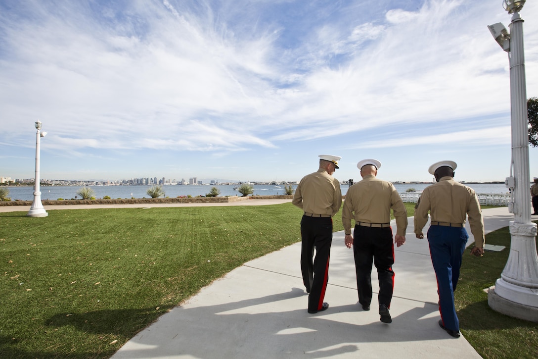 Lt. Gen. Mark A. Brikalis, the commanding general of Marine Corps Recruiting Command (MCRC), left, Commandant of the Marine Corps, Gen. Robert B. Neller, center, and Sgt. Maj. Samuel Heyward Jr., the sergeant major of MCRC walk towards a ceremony at Point Loma, Calif., Dec. 3, 2015. Neller was the guest of honor at the superior achiever ceremony for Marines of the Western and Eastern Recruiting Region. (U.S. Marine Corps photo by Staff Sgt. Gabriela Garcia/Released)