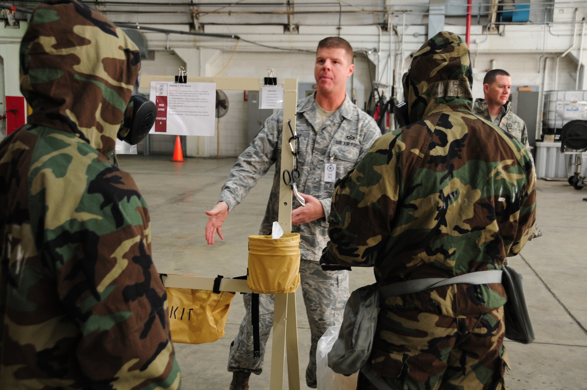 Pennsylvania Air National Guardsman from the 171st Air Refueling Wing practice decontamination training while process are observed by inspectors from Air Mobility Command during the unit’s efficiency inspection Oct. 18, 2015 (U.S. Air National Guard Photo by Senior Airman Allyson Manners/Released)