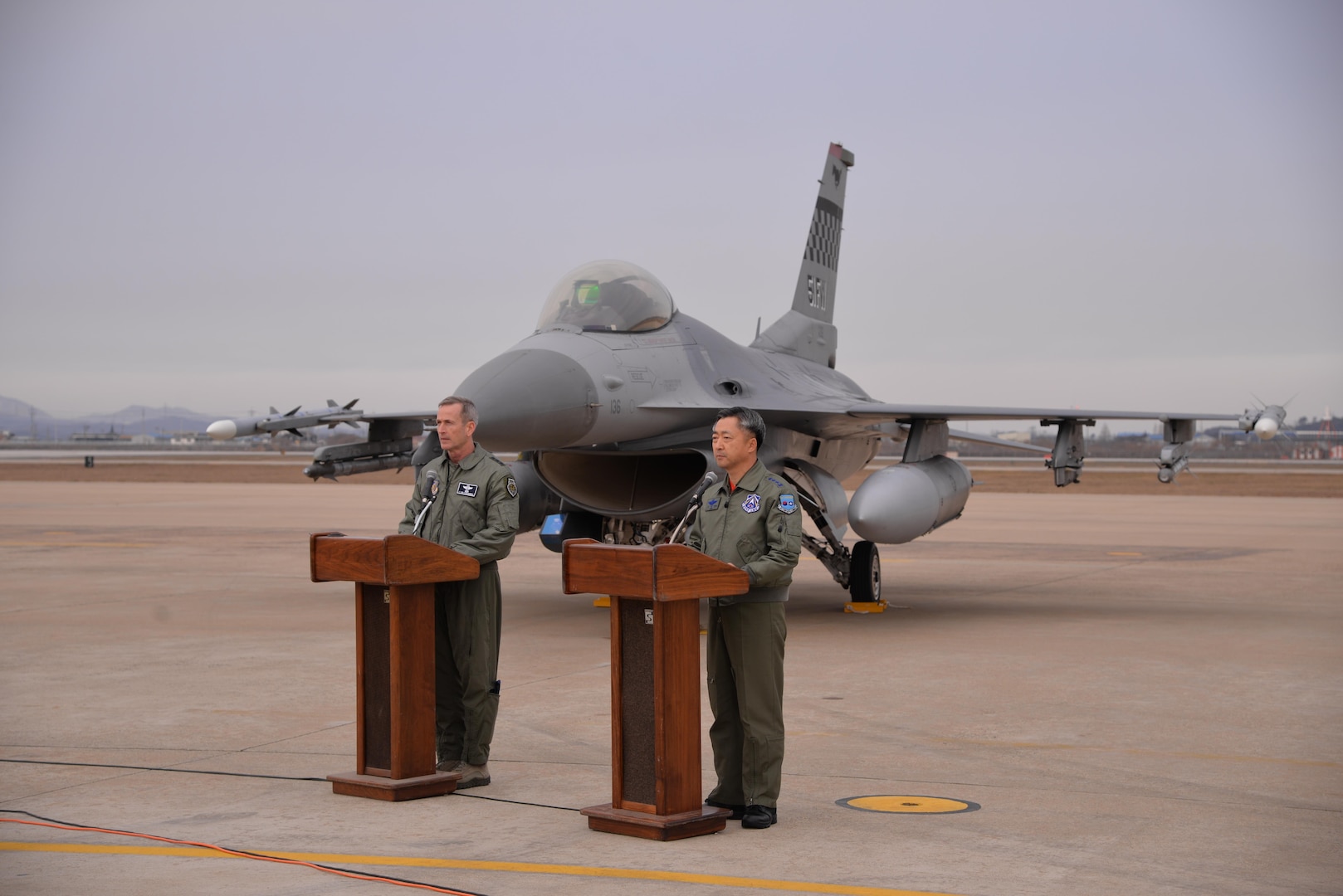 United Nations Command, U.S. Forces Korea deputy commander and U.S. 7th Air Force commander, Lt. Gen. Terrence O'Shaughnessy and Lt. Gen. Wang-keon Lee, ROK Air Force Operations Command commander, speak to Korean and international media at Osan Air Base, South Korea, Jan. 10, 2016, prior to a low-level pass from a U.S. Air Force B-52 Stratofortress in response to recent provocative action by North Korea. The B-52 was joined by a ROKAF F-15 Slam Eagle and a U.S. Air Force F-16 Fighting Falcon.  The B-52 is a is a long-range, heavy bomber that can fly up to 50,000 feet and has the capability to carry 70,000 pounds of nuclear or precision guided conventional ordnance with worldwide precision navigation capability. (U.S. Air Force photo/Staff Sgt. Benjamin Sutton)