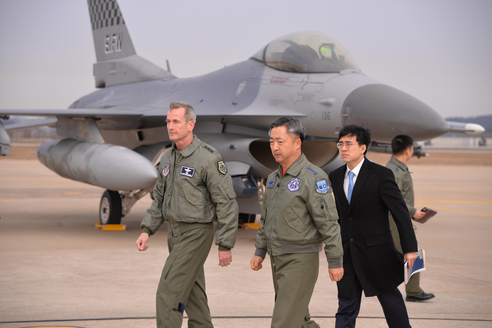 United Nations Command, U.S. Forces Korea deputy commander and U.S. 7th Air Force commander, Lt. Gen. Terrence O'Shaughnessy and Lt. Gen. Wang-keon Lee, ROK Air Force Operations Command commander, leave the podium area after speaking to Korean and international media at Osan Air Base, South Korea, Jan. 10, 2016, prior to a low-level pass from a U.S. Air Force B-52 Stratofortress in response to recent provocative action by North Korea. The B-52 was joined by a ROKAF F-15 Slam Eagle and a U.S. Air Force F-16 Fighting Falcon. The B-52 is a is a long-range, heavy bomber that can fly up to 50,000 feet and has the capability to carry 70,000 pounds of nuclear or precision guided conventional ordnance with worldwide precision navigation capability. (U.S. Air Force photo/Staff Sgt. Benjamin Sutton)